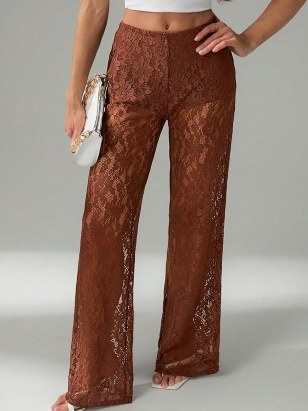 Elegant high-rise lace pants with a flattering wide-leg silhouette. Soft rust